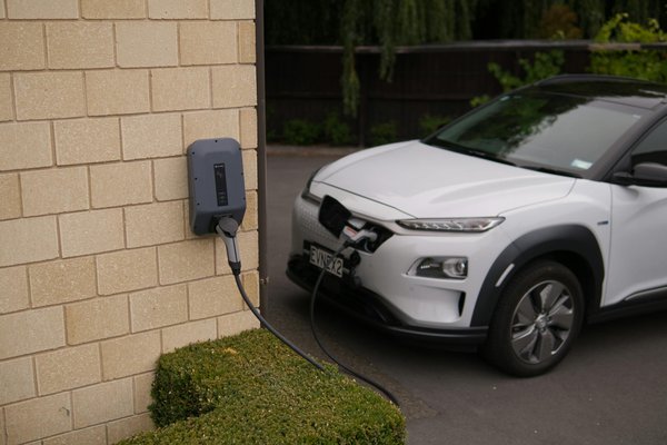 What are the implications of the electric vehicle boom on residential property values with parking facilities in London?